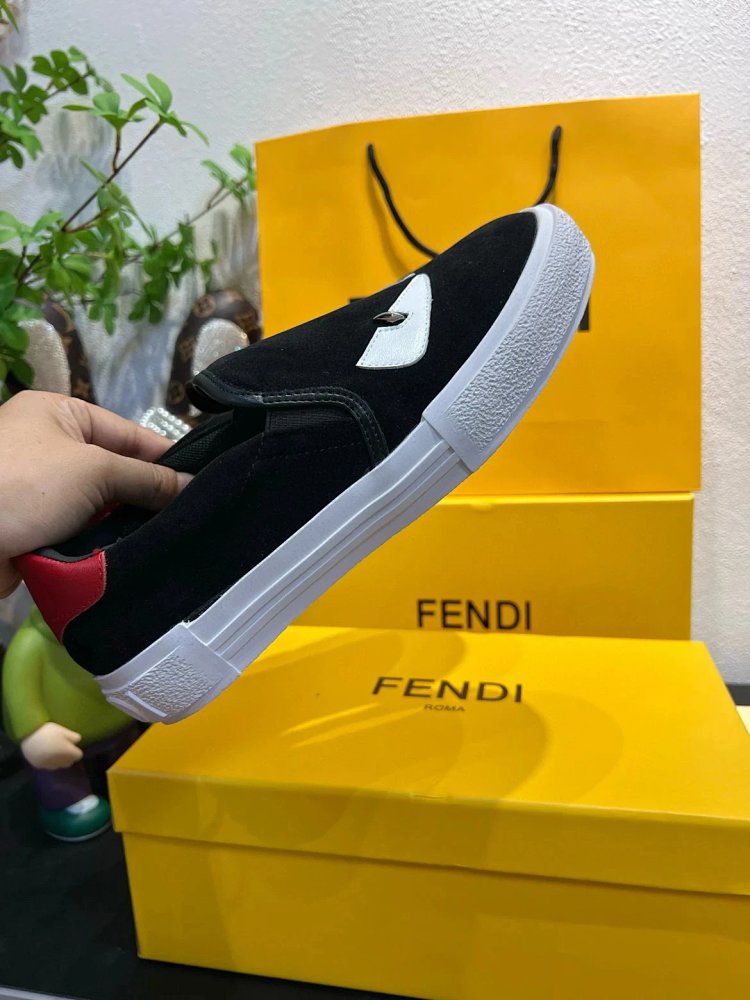 Fendi Monster stomps on board shoes with one foot